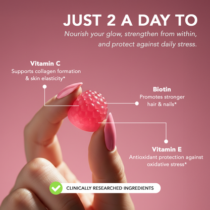 Hand holding Zerean Bloom gummy with ingredient highlights — biotin, vitamin C, and vitamin E to nourish hair, skin, and nails.