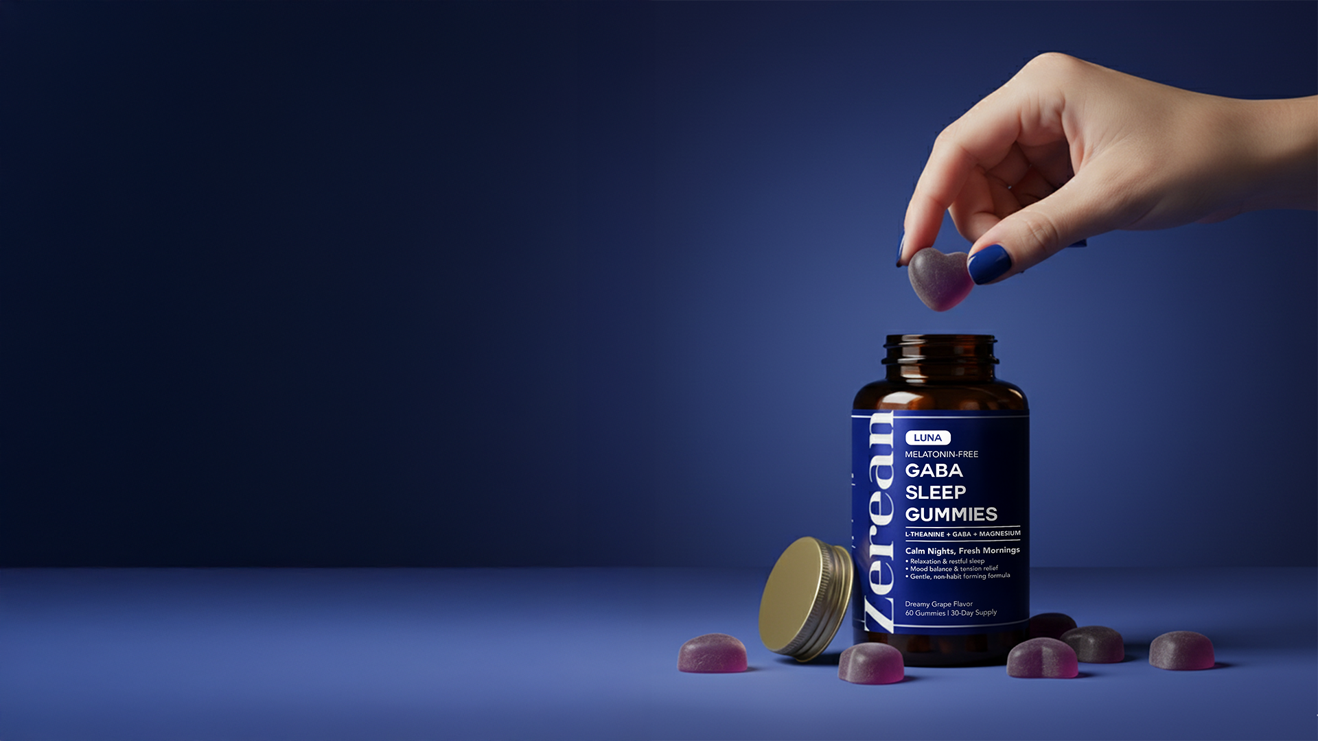 Hand picking heart-shaped Zerean Luna GABA Sleep Gummy — melatonin-free sleep support for calm nights and refreshed mornings.